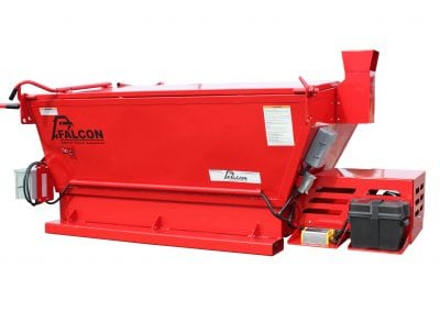 A red Falcon slip-in hot box is about to be loaded onto a truck's bed.