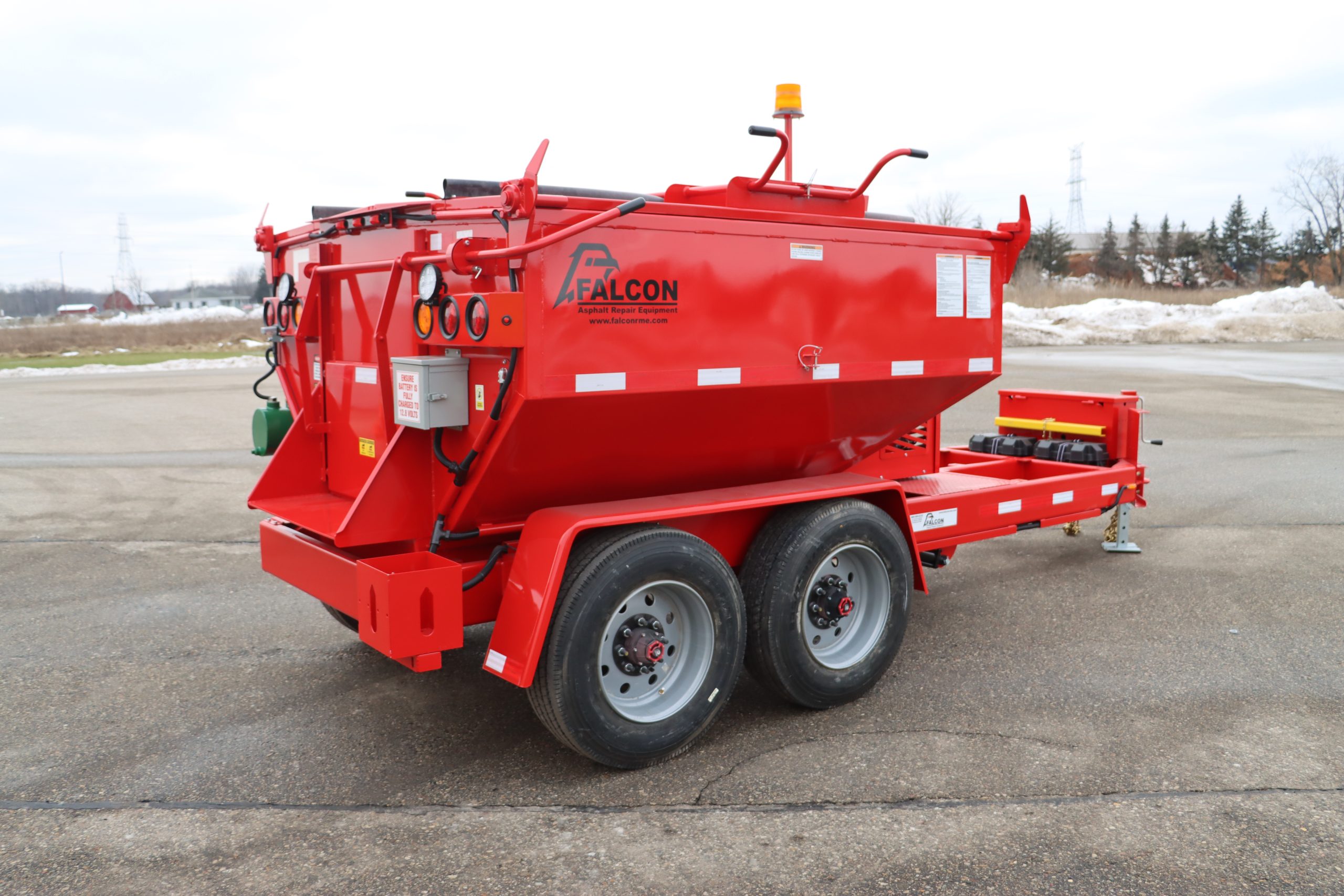 ALTA 6 Ton Work crew using a Falcon 6-Ton Asphalt Hot Box